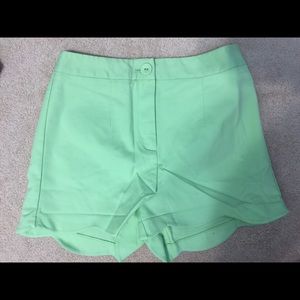 Green scalloped shorts